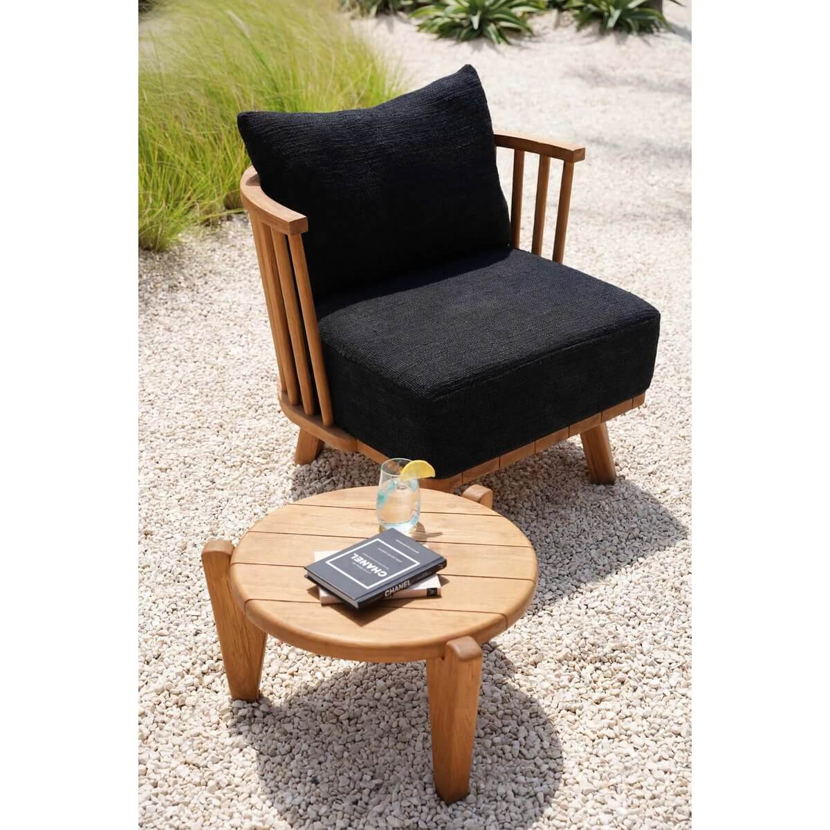Bohemian style black teak one-seater with cushions, perfect for indoor or covered outdoor spaces, showcasing elegance and comfort.