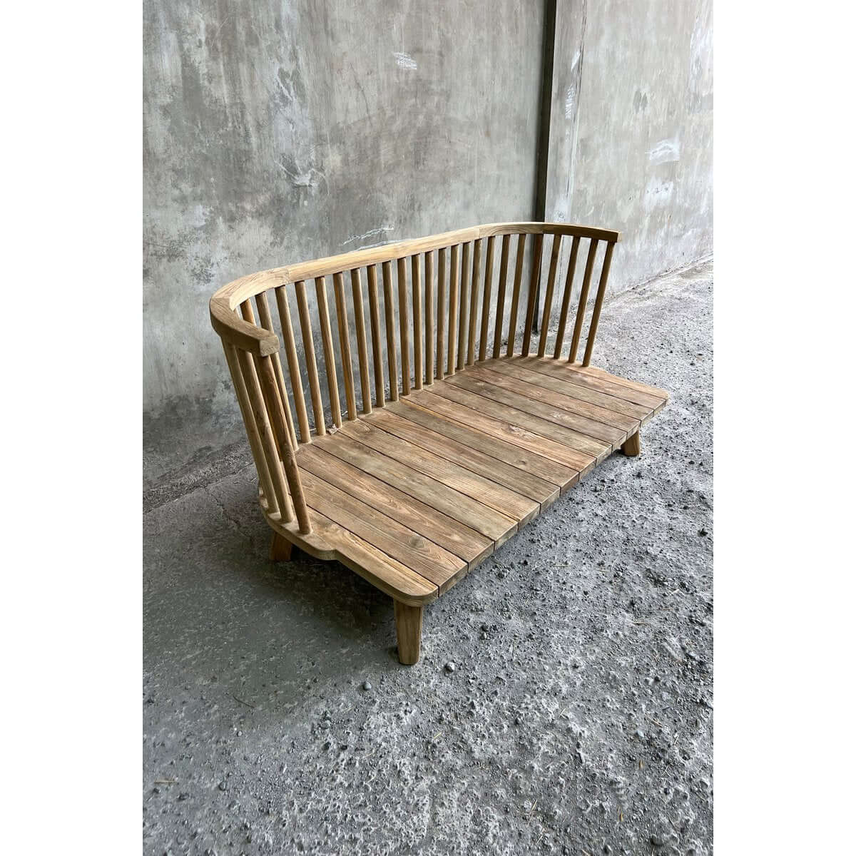 Bohemian style one-seater made from recycled teak, perfect for cozy indoor or outdoor spaces with its unique design.