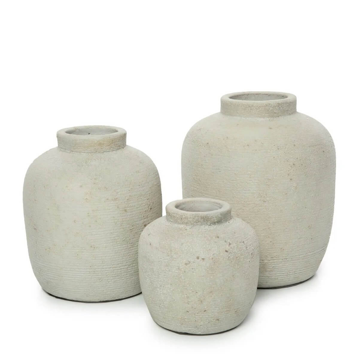 Trio of terracotta Peaky vases in a Bohemian style, perfect for dried or fresh flowers, adding charm to any living space or bathroom.