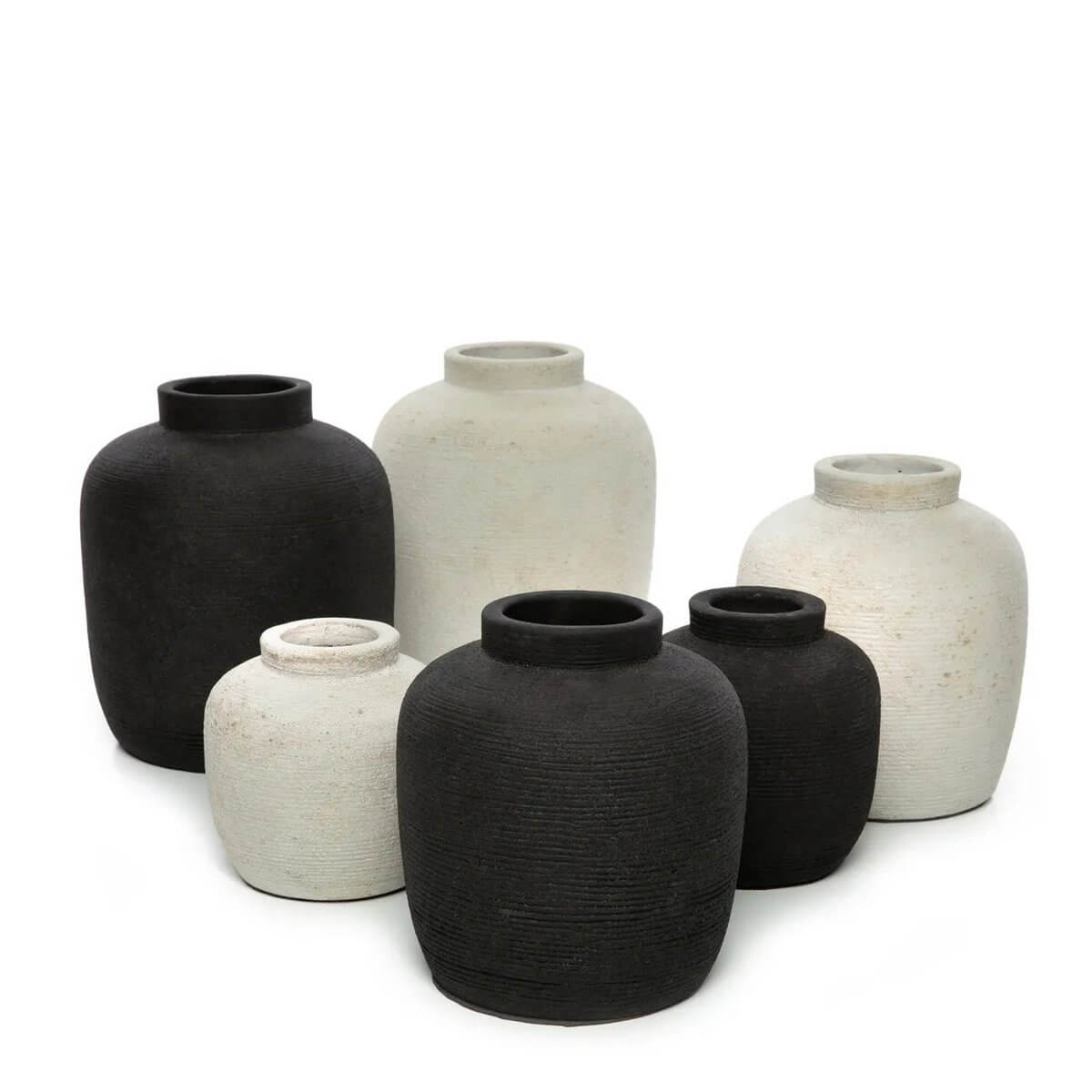 Set of black and white Peaky vases made of terracotta, perfect for Bohemian home decor with fresh or dried flowers.