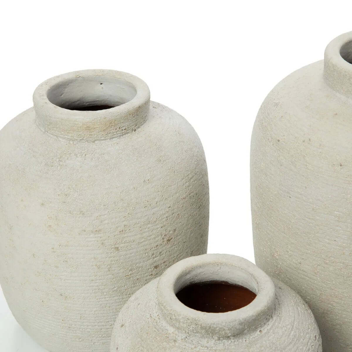 Bohemian style terracotta Peaky vases made from beton, perfect for flowers and eco-friendly decor accents in living room or bathroom.