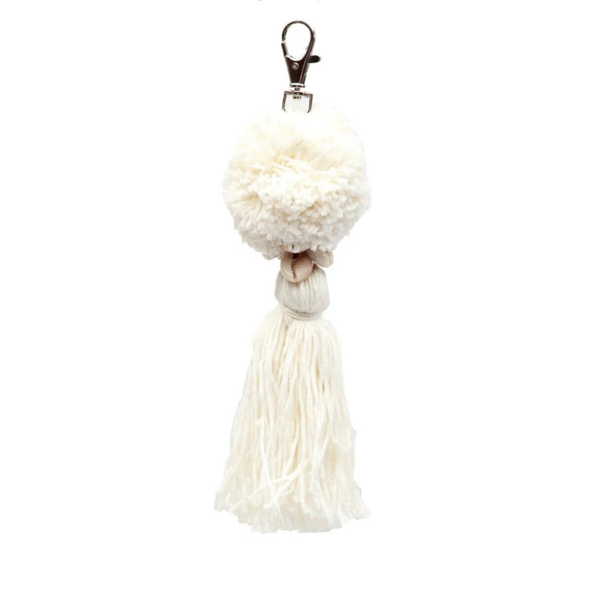 Bohemian white cotton pompom keychain with tassel, perfect for adding charm to keys or bags. Soft texture, stylish accessory.