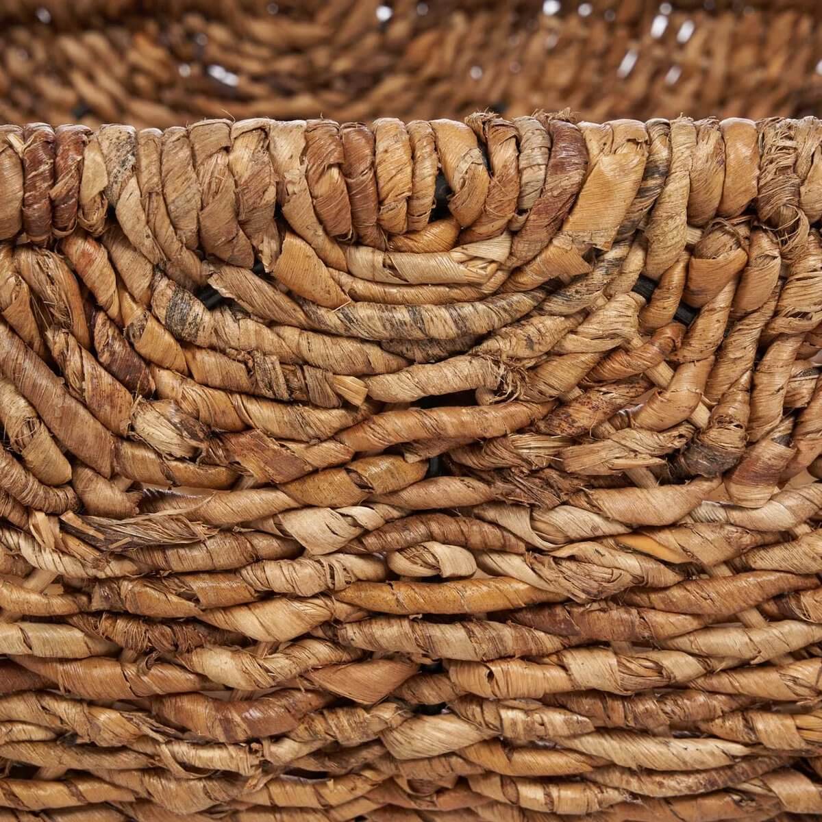Close-up of the Rayah Basket, showing its intricate natural banana leaf weaving, adding bohemian elegance to any decor.