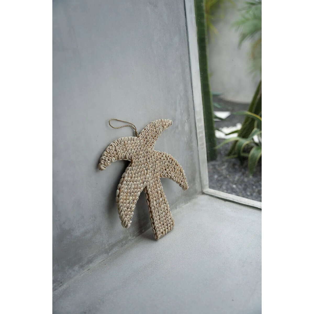 Bohemian decor palm tree made of shells, hand-crafted in Bali for Bazar Bizar Living, perfect for adding a tropical touch to any space.