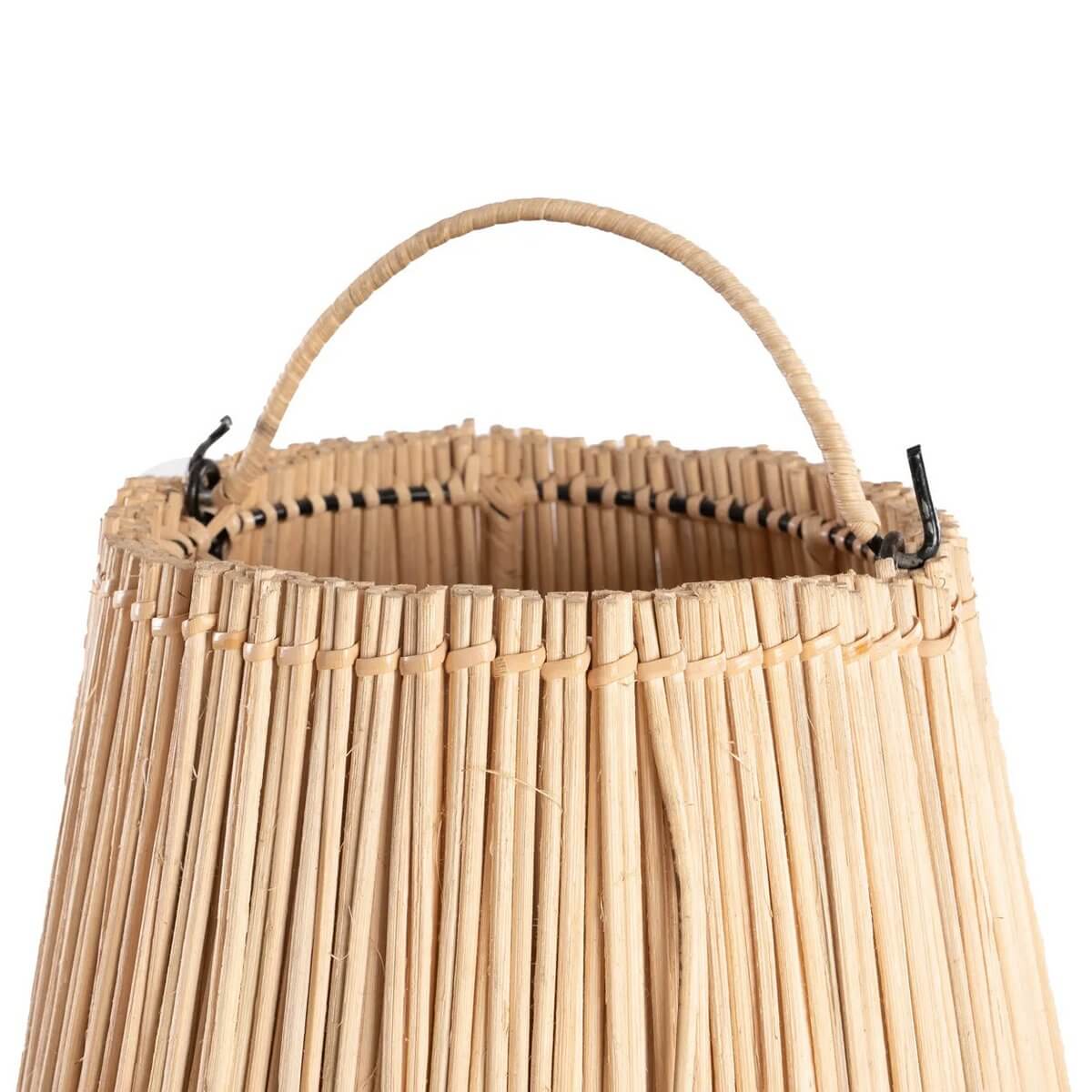 Close-up of De Shala bohemian rattan lamp with a natural, organic design, featuring a textured weave and handle detail.