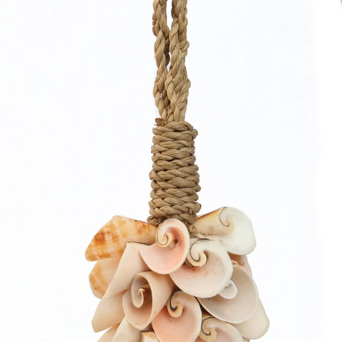 Handmade pink shell and cotton hanger by Balinese artisans, adds a bohemian touch to decor. Unique design by Bazar Bizar Living.