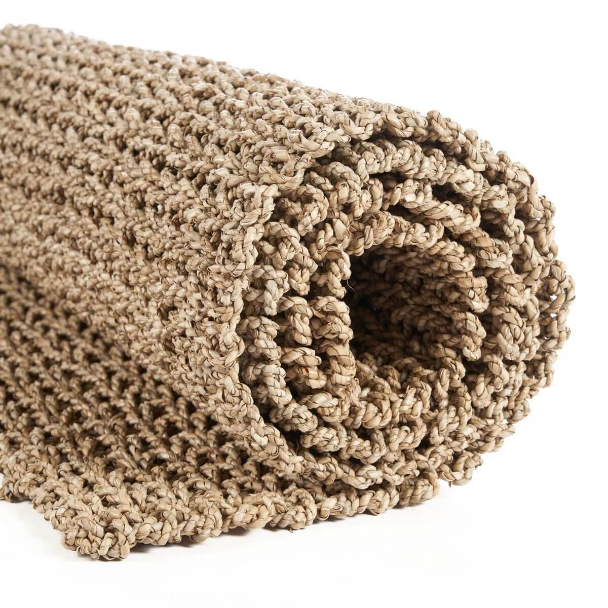 Rolled natural beige sizal rug with bohemian woven texture, perfect for adding earthy elegance to any room - 200x70