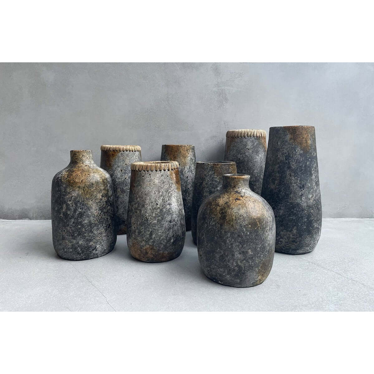 Bohemian-style antique grey terracotta vases, perfect for displaying dried or fresh flowers, adding charm to any room.