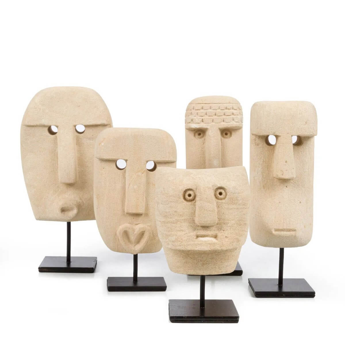 Five Bohemian Sumba stone sculptures on stands from Indonesia, hand-carved and perfect for a unique cultural display.