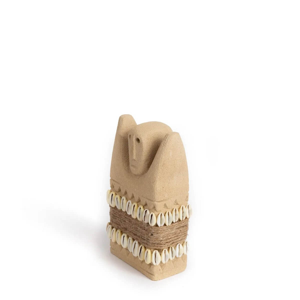 Hand-carved Sumba stone statue from Indonesia, adorned with shells and twine, showcasing a Bohemian style ideal for home decor.