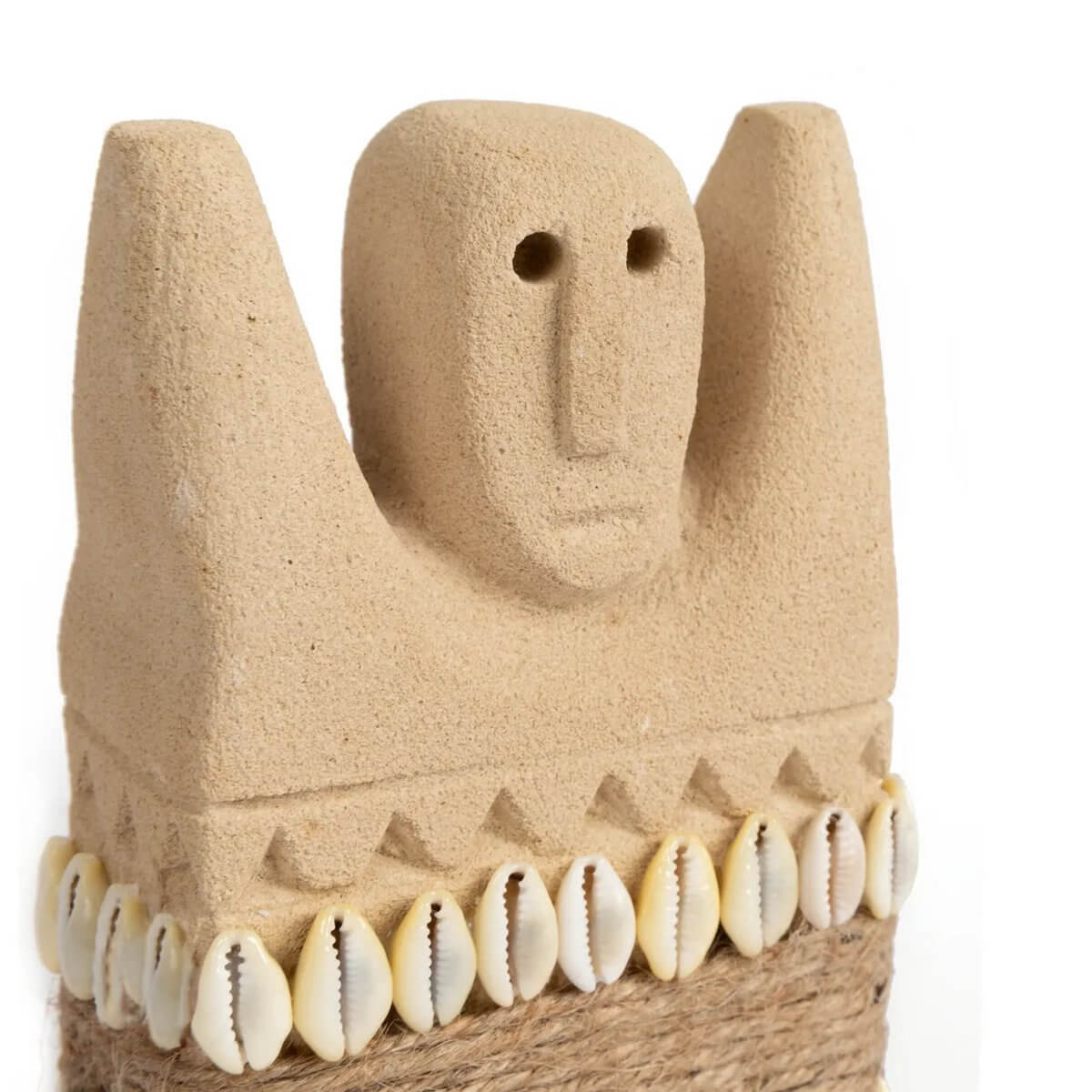Handcrafted Sumba sandstone figure with seashell accents, embodying bohemian style and traditional Indonesian artistry.