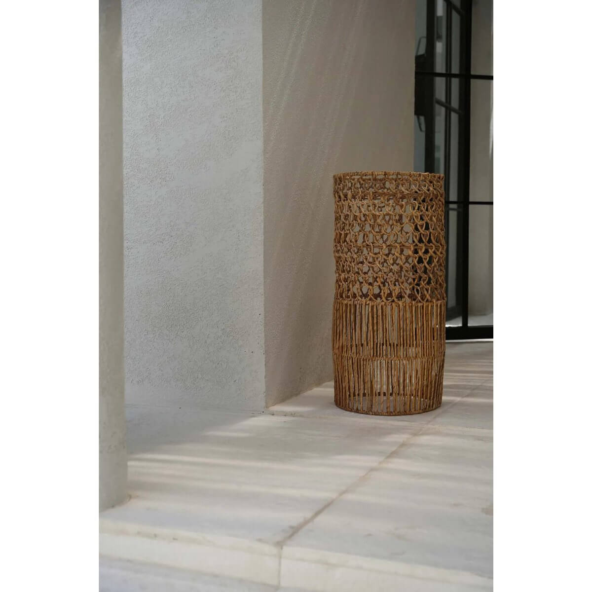 Handmade Takuhanki Lamp in banana leaf, bohemian style, displayed in a modern hallway, enhancing natural decor.