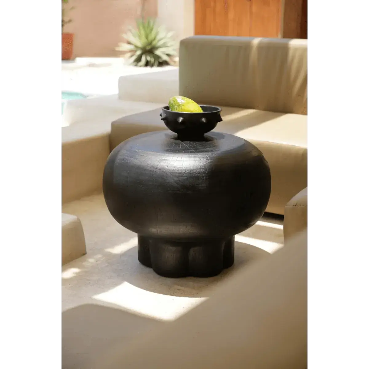 Bohemian Tutup Black Coffee Table in suar wood with whimsical jellyfish-inspired design, perfect as a centerpiece.