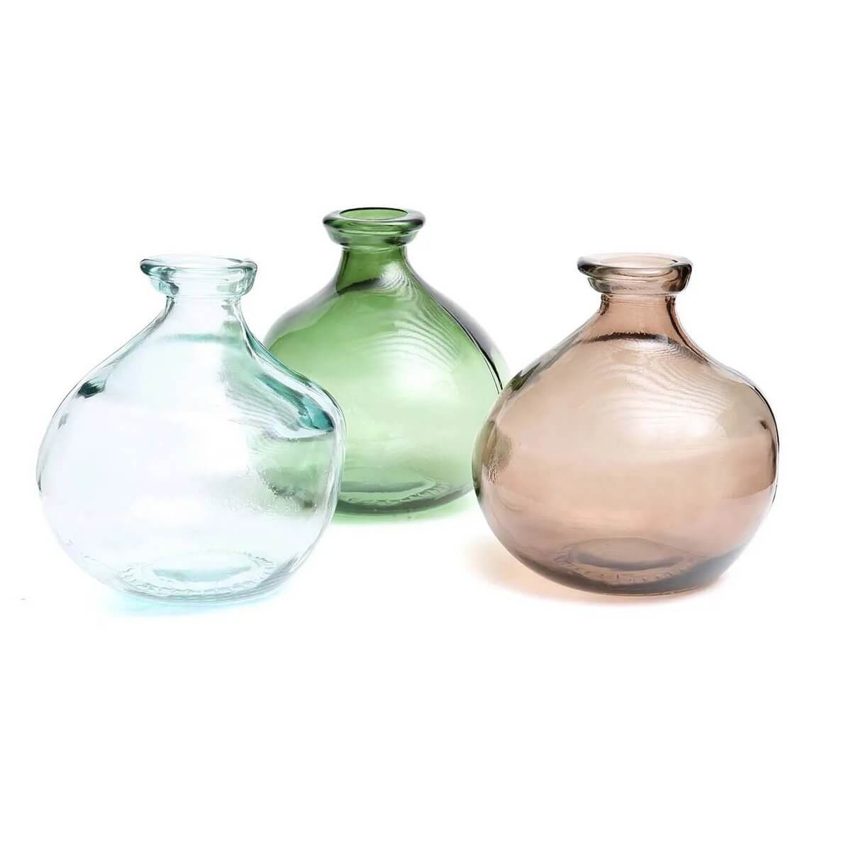 Three De Xiao Bohemian-style vases in soft colors, showcasing organic curves for a subtle yet stylish home decor touch.