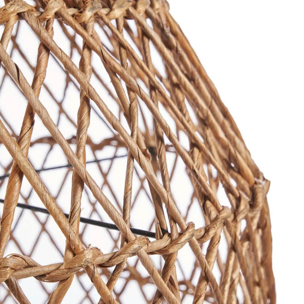 Close-up of Xiomara Bohemian hanger made of natural banana leaf, showcasing woven texture and warm charm.