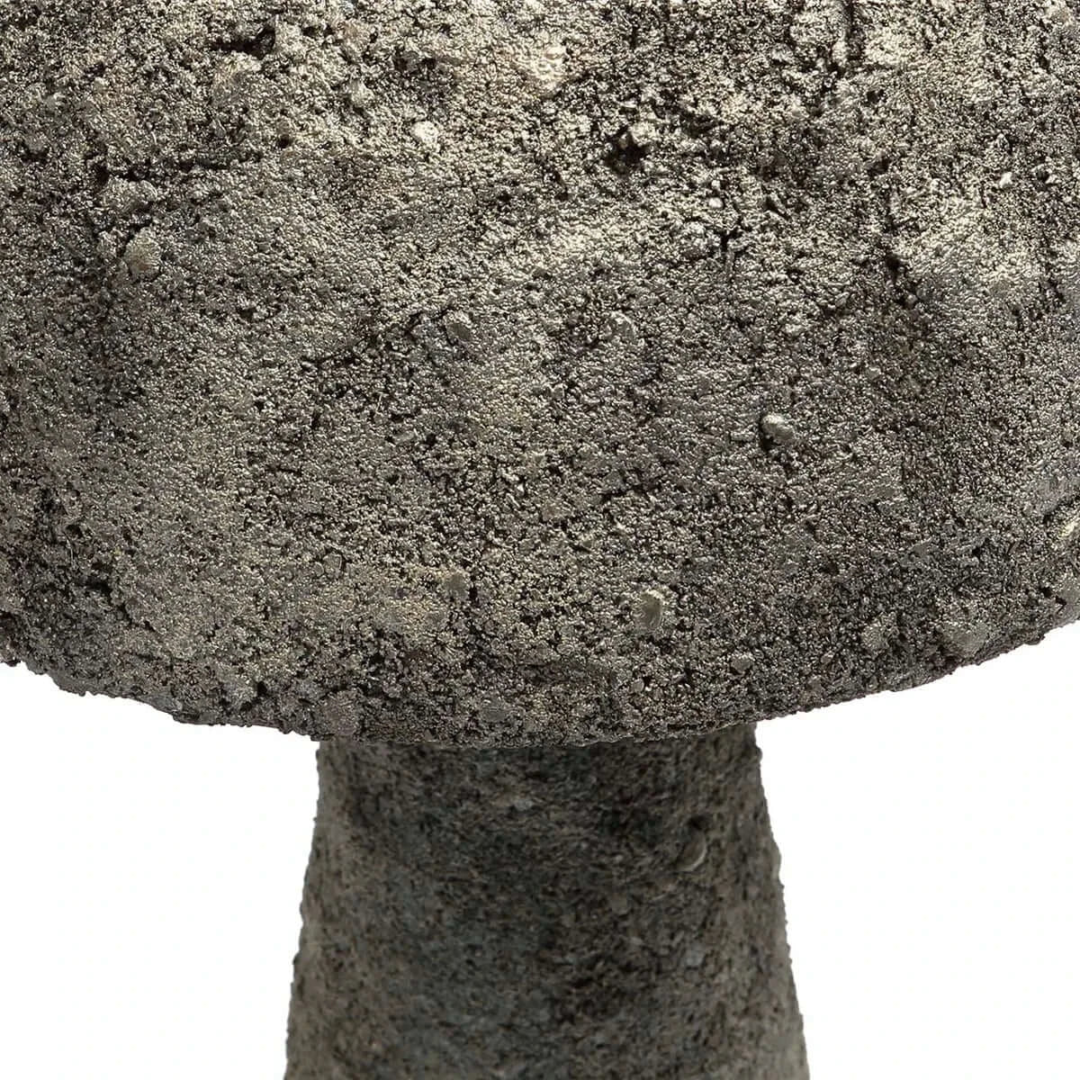 Close-up of a concrete mushroom-shaped lamp base with textured stone surface, showcasing industrial-chic design details.