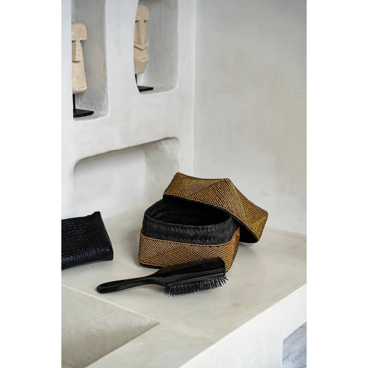 Handmade gold beaded boxes by Balinese artisans, bohemian style, perfect for decor or storage, on a shelf.