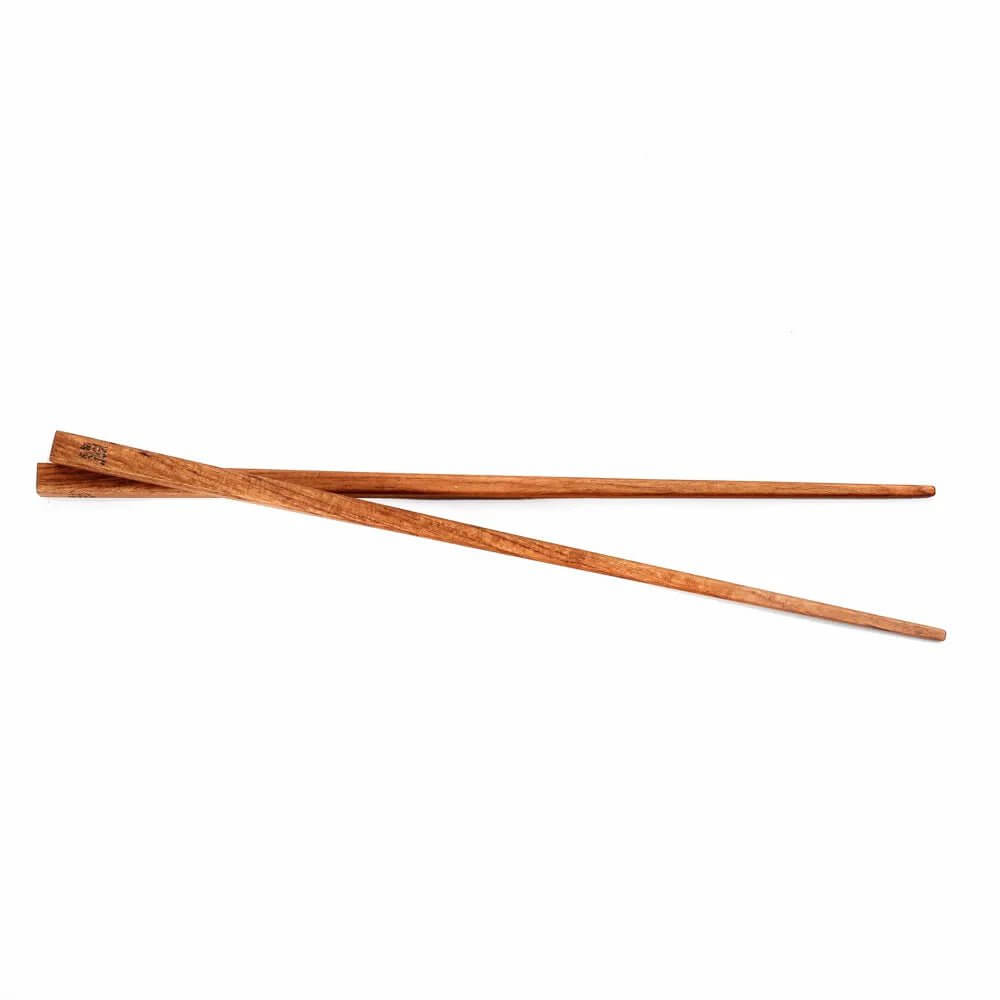 Bohemian teak root chopsticks with brown wooden finish from Bazar Bizar Living. Stylish and sustainable dining accessory.