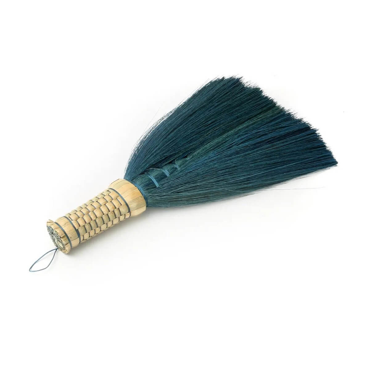 Bohemian turquoise hand broom made from Indonesian grass, perfect for stylish cleaning and decor.