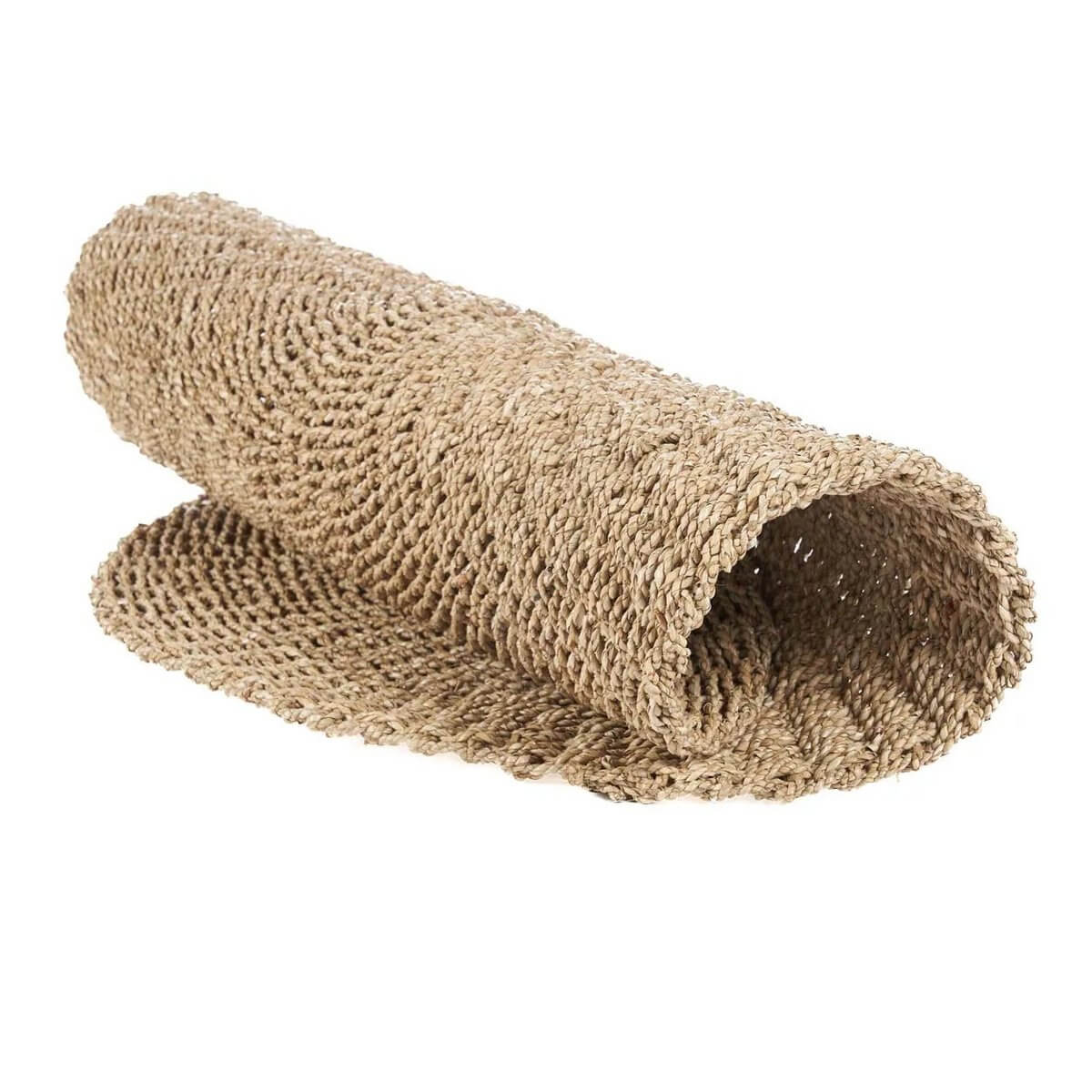 Rolled natural sisal rug for bohemian decor, featuring earthy tones and woven texture.