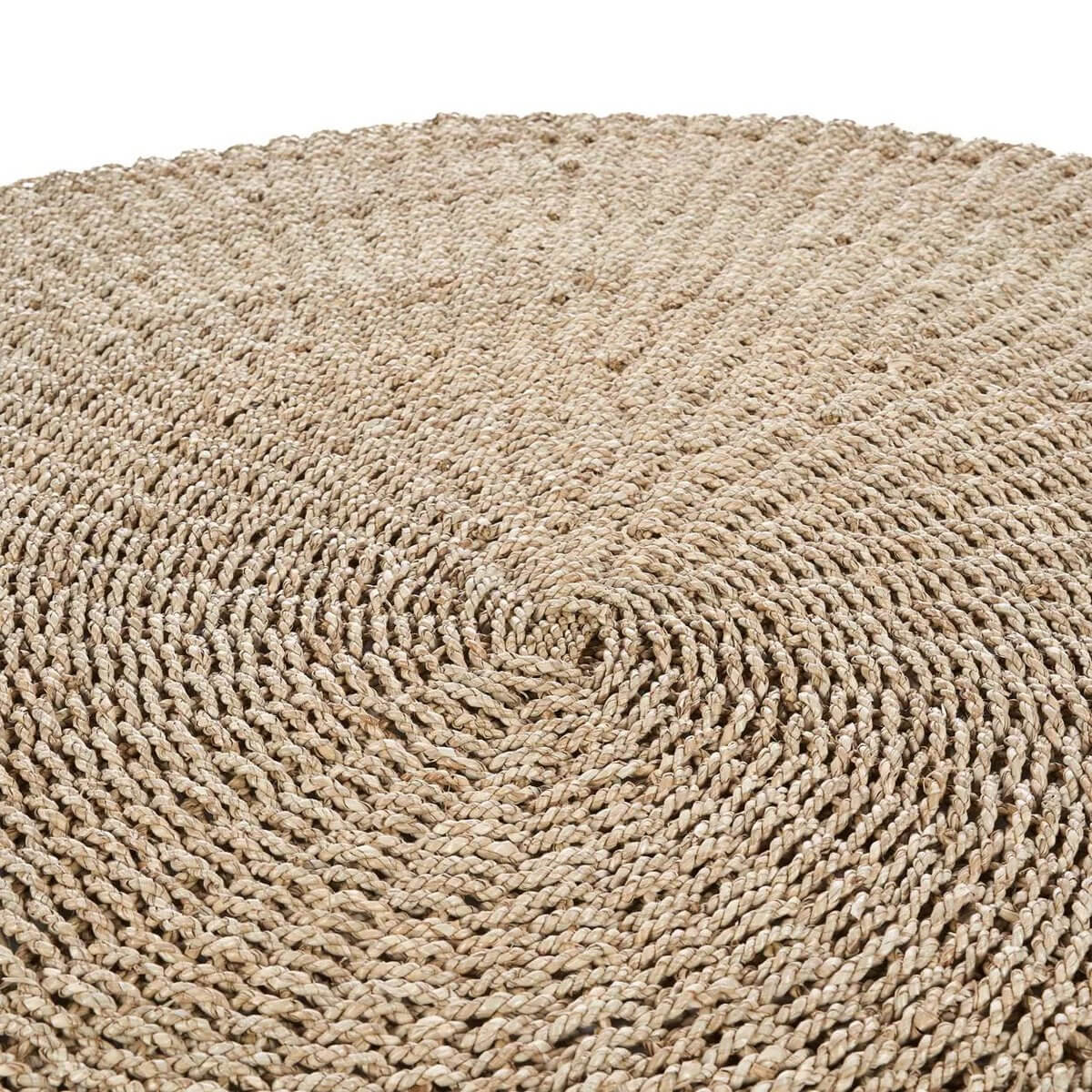 Close-up of a round, woven, natural sisal rug with intricate texture, perfect for adding a Bohemian touch to any room.