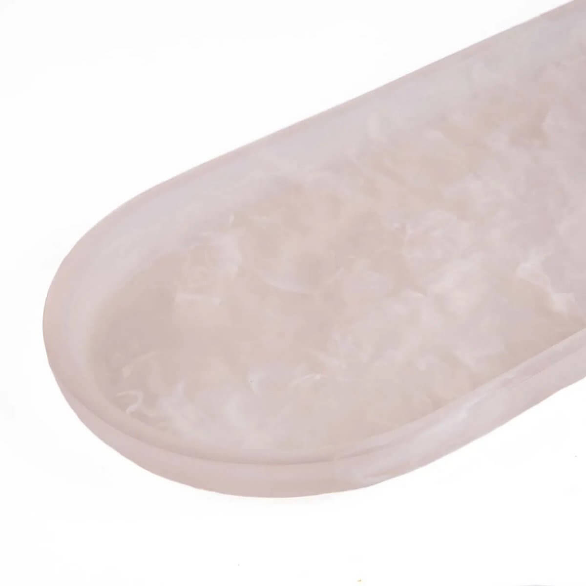 Elegant Bohemian pink and white resin oval serving board, perfect for stylish presentations of appetizers and desserts.