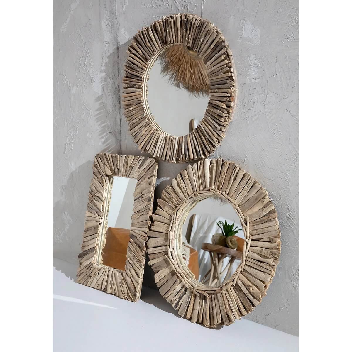 Bohemian-style driftwood mirrors in varied shapes, perfect for creating a stunning accent wall. Natural and unique design.