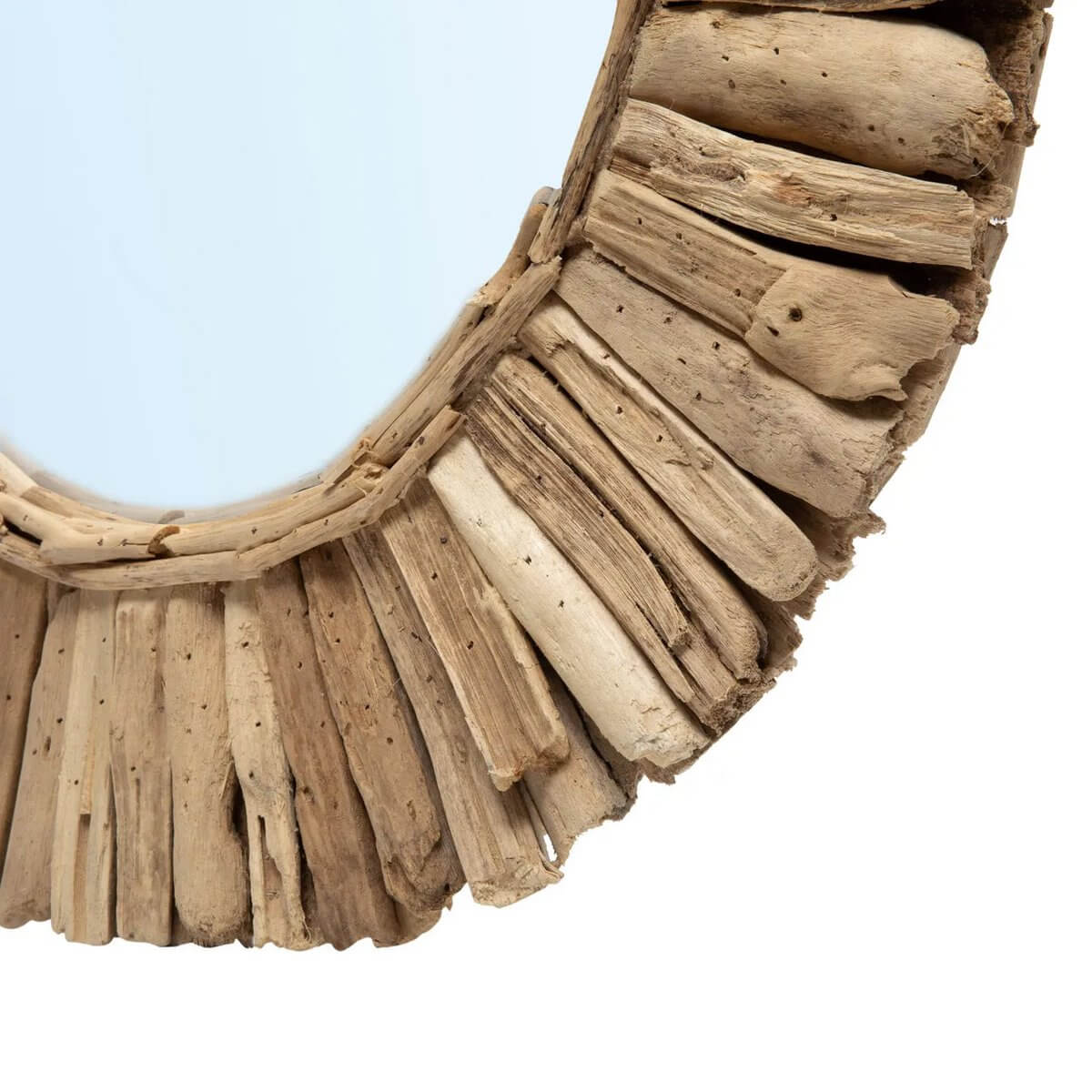Bohemian driftwood crown mirror with natural wood pieces around circular glass, creating a unique artistic accent; by Bazar Bizar Living.