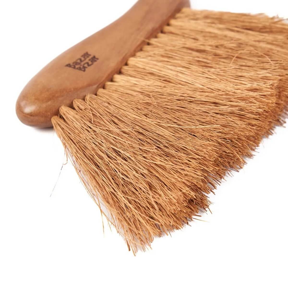 Bohemian-style Maha Brush with natural teak handle for elegant crumb sweeping.