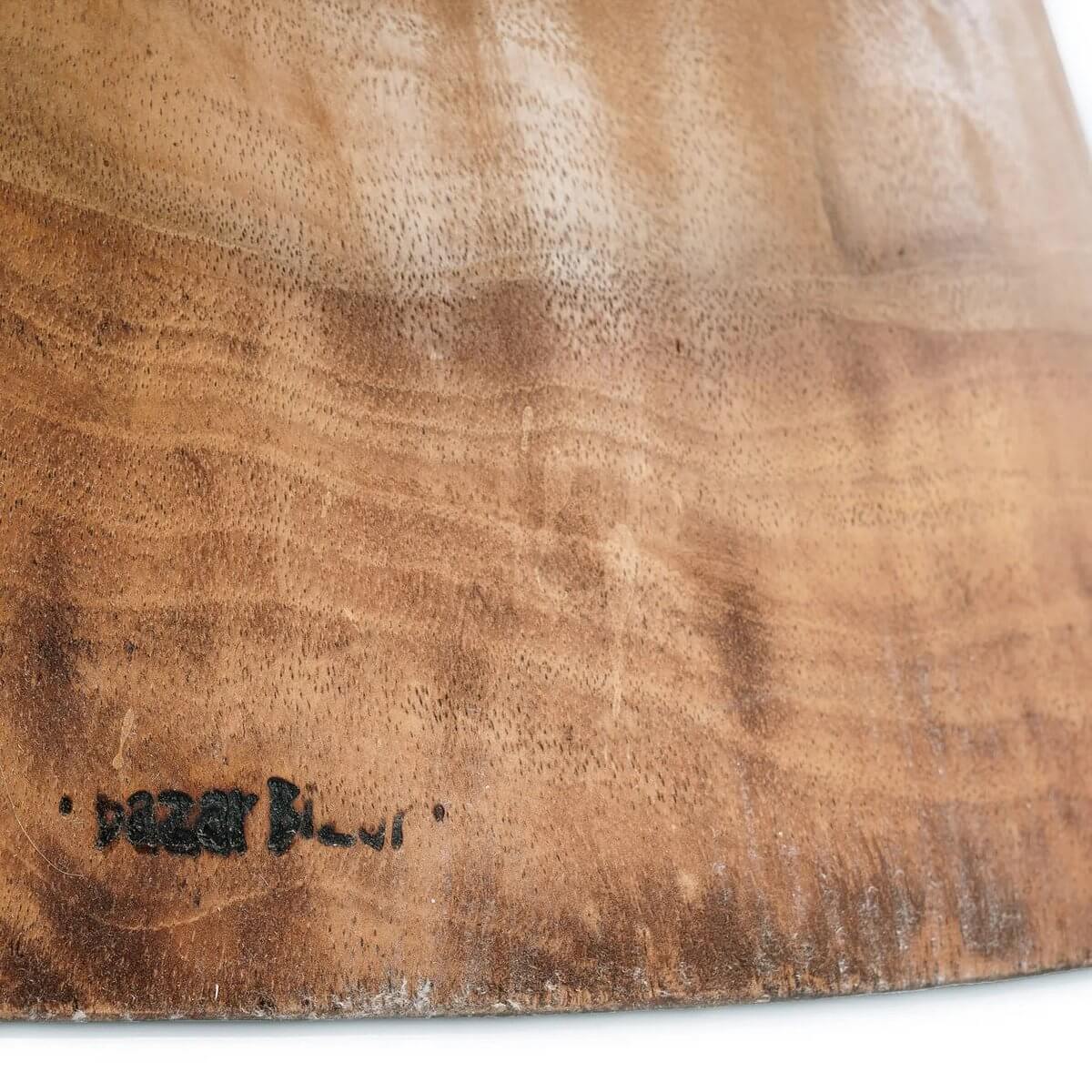 Close-up of De Mitcha Kruk's natural wood finish highlighting its Bohemian style and unique grain patterns.