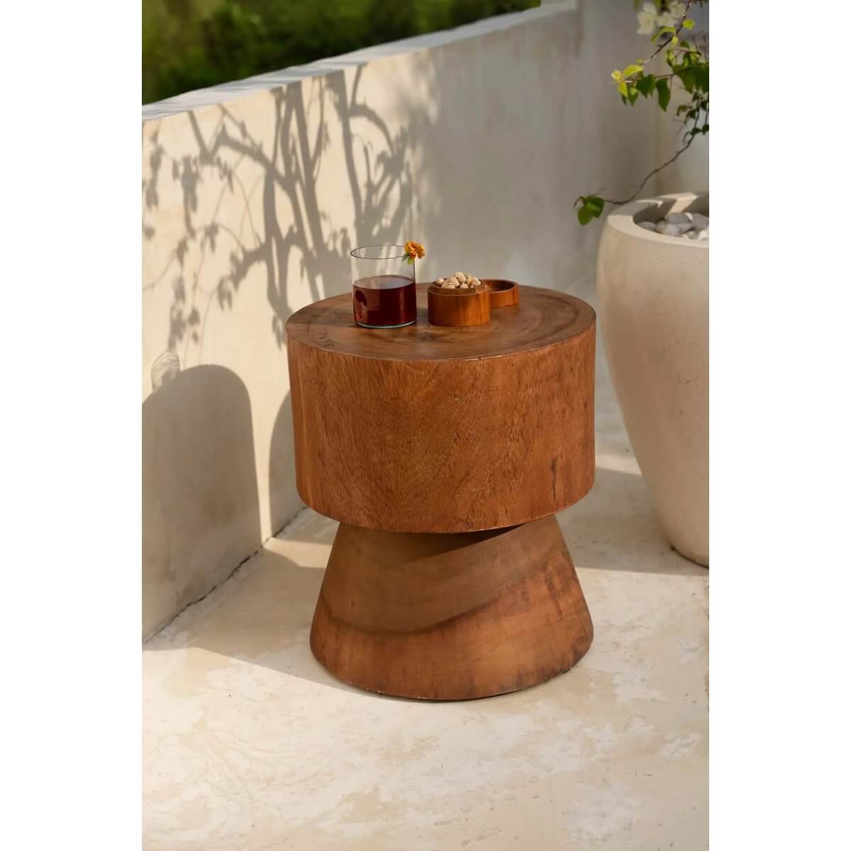 De Mitcha Kruk - Naturel: Bohemian style wooden stool or side table on patio with drinks, showcasing minimalist design and natural wood grain.