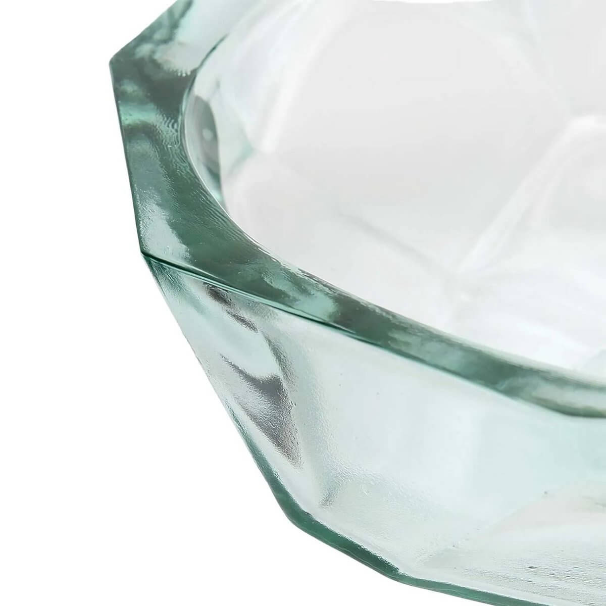 Close-up of The Origami Bowl in blue, showcasing its sharp, angular lines and folded design for a modern Bohemian table setting.