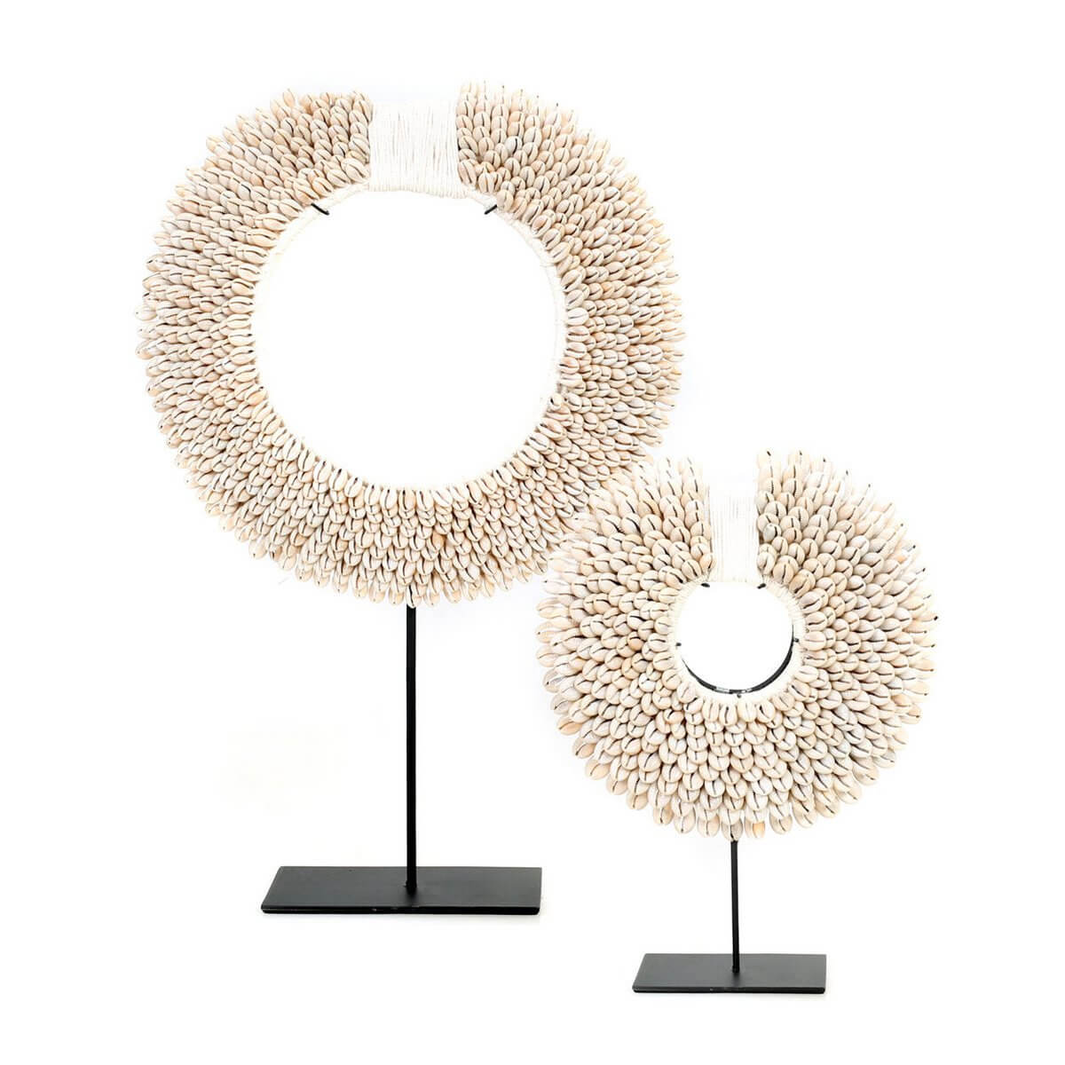 Elegant white shell disc on black stand, handcrafted for a unique Bohemian coastal decor accent. Brand: Bazar Bizar Living.