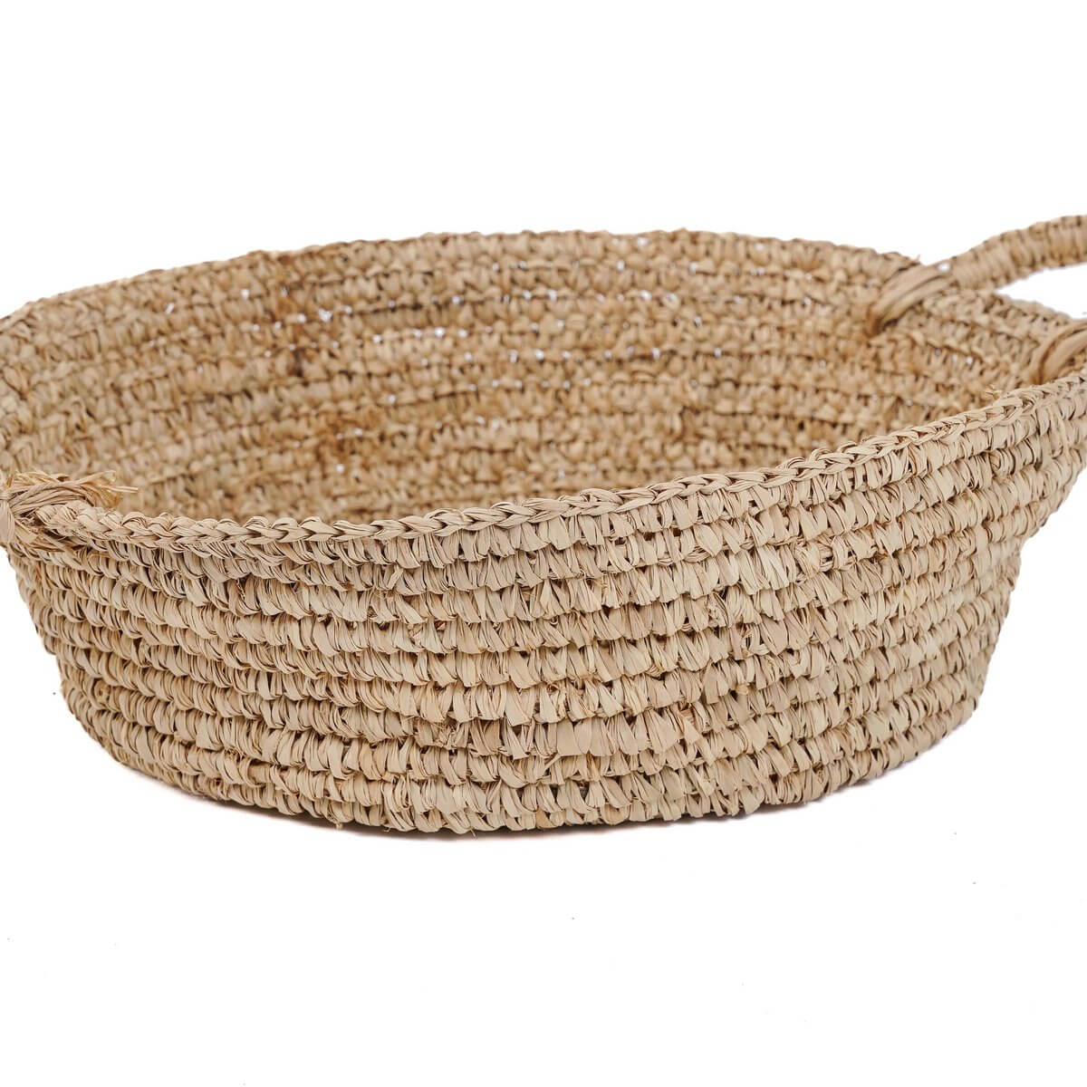Bohemian style naturel raffia basket, perfect for small spaces and adding rustic elegance to any room.