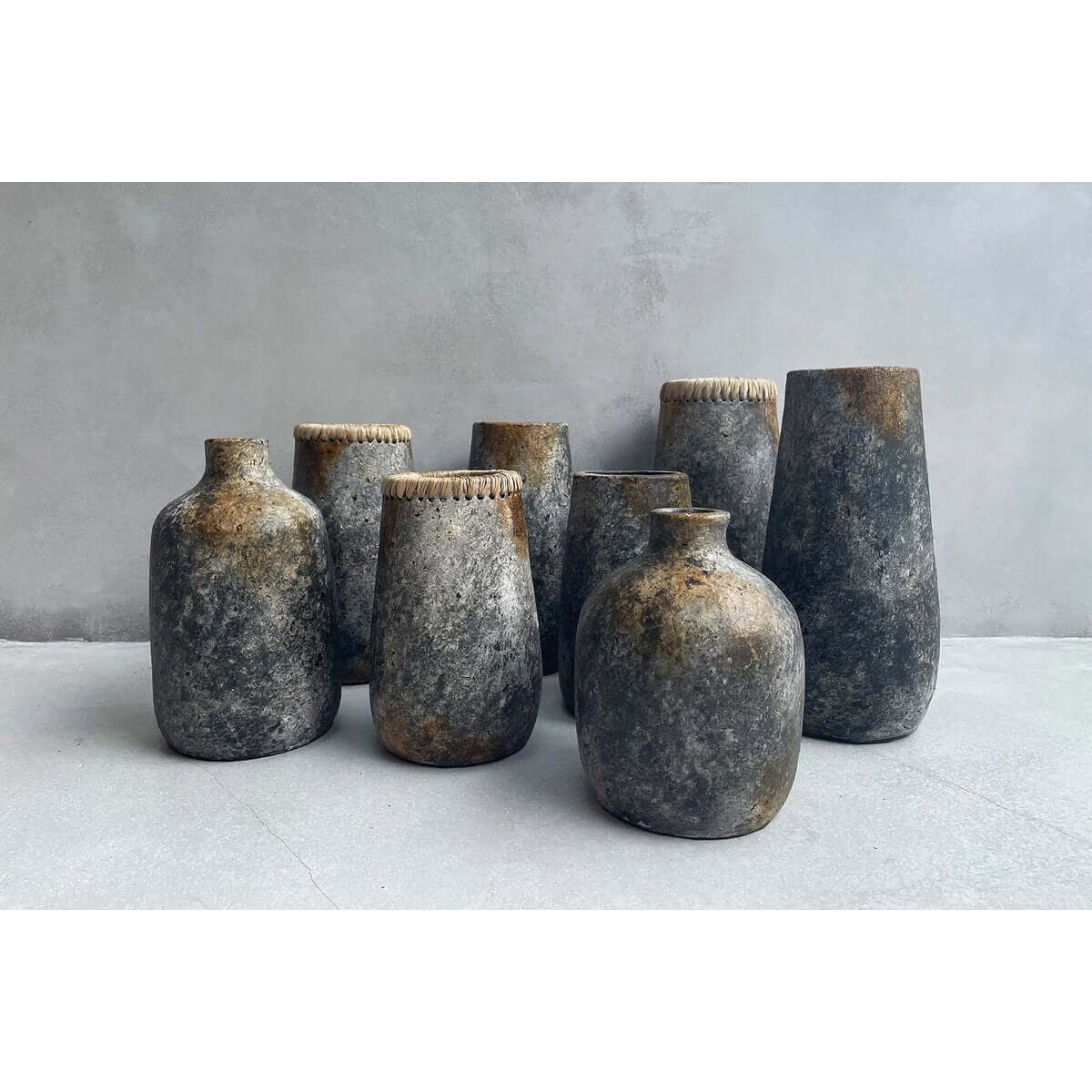 Collection of Bohemian-style antique grey terracotta vases on display, perfect for adding charm to any room with dried or fresh flowers.