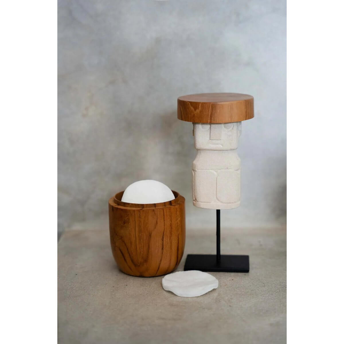 Bohemian stone statue from Sumba on a stand, perfect for adding tribal charm to your decor. Hand-carved, white, and vintage aesthetic.