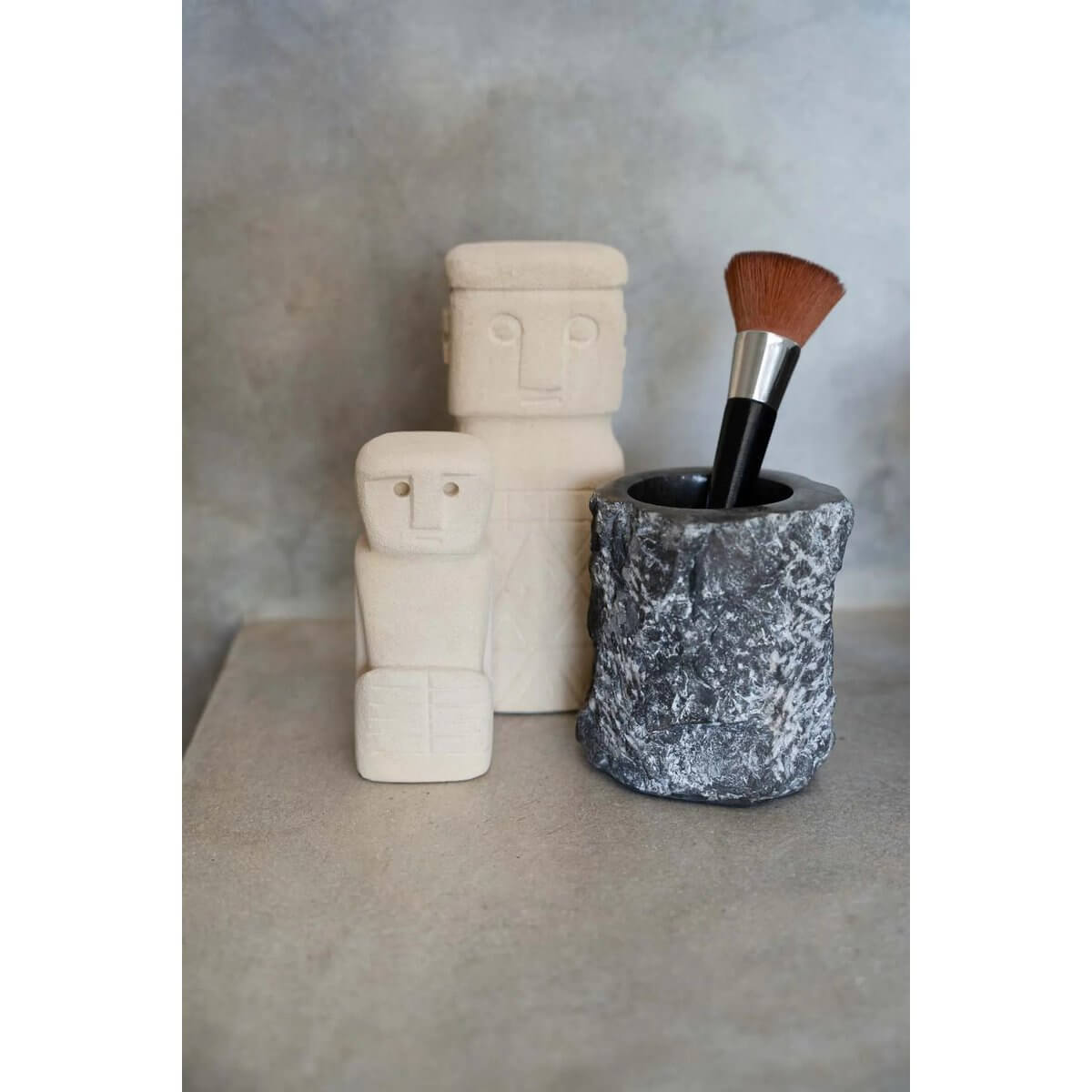 Bohemian Sumba sandstone statues with makeup brush holder, handcrafted on Sumba Island, Indonesia.