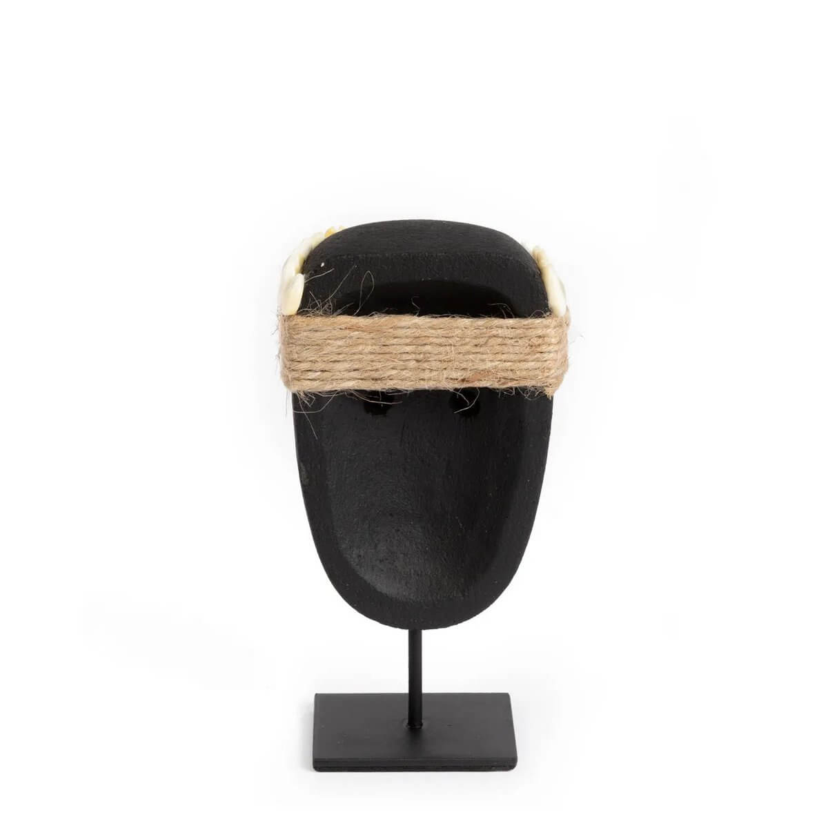 Bohemian De Sumba-steen #35 on stand, hand-carved sandstone sculpture from Sumba, Indonesia, showcasing rustic elegance and cultural heritage.