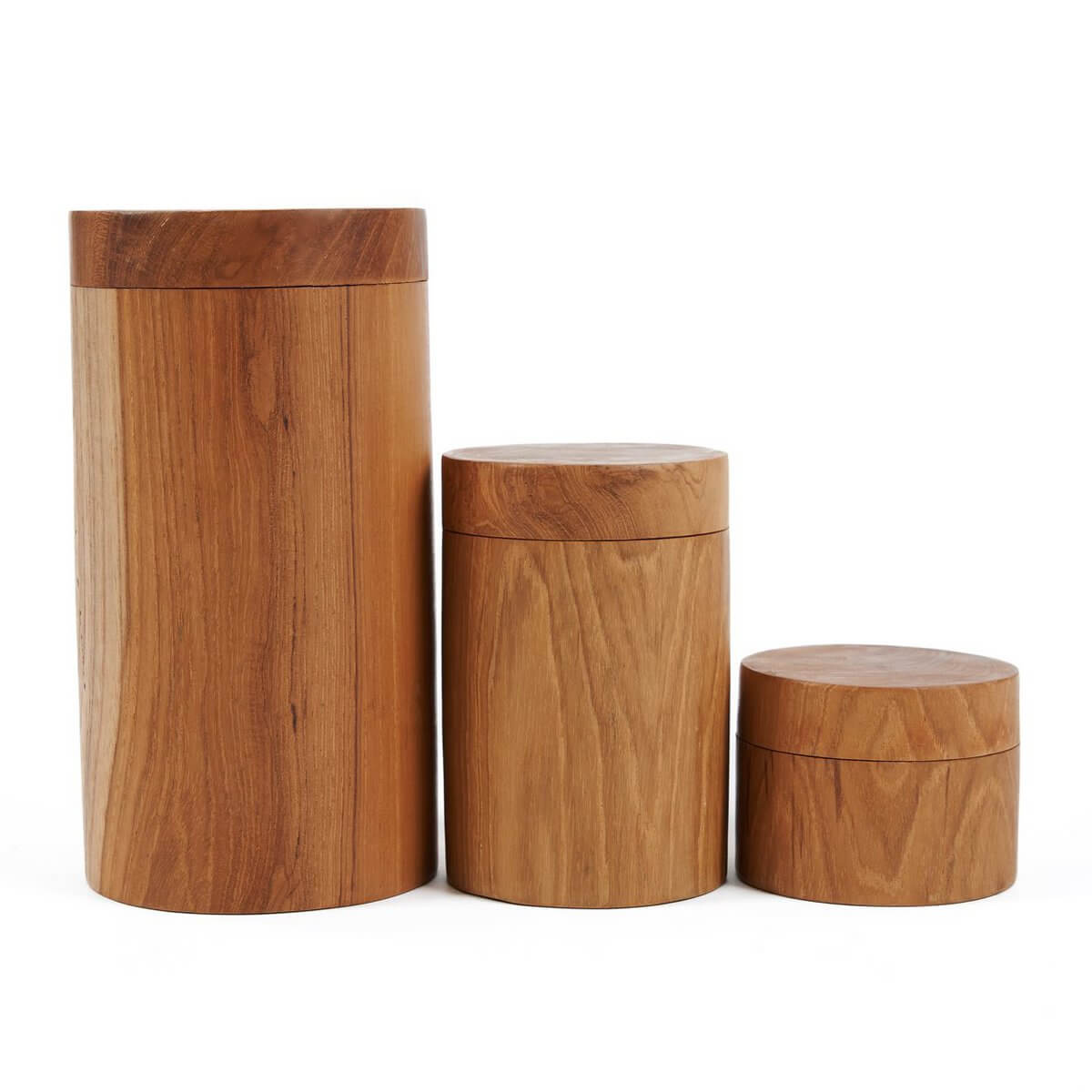 Three handcrafted Teak Root Jars in varying sizes, showcasing intricate Bohemian designs and organic textures for stylish storage.
