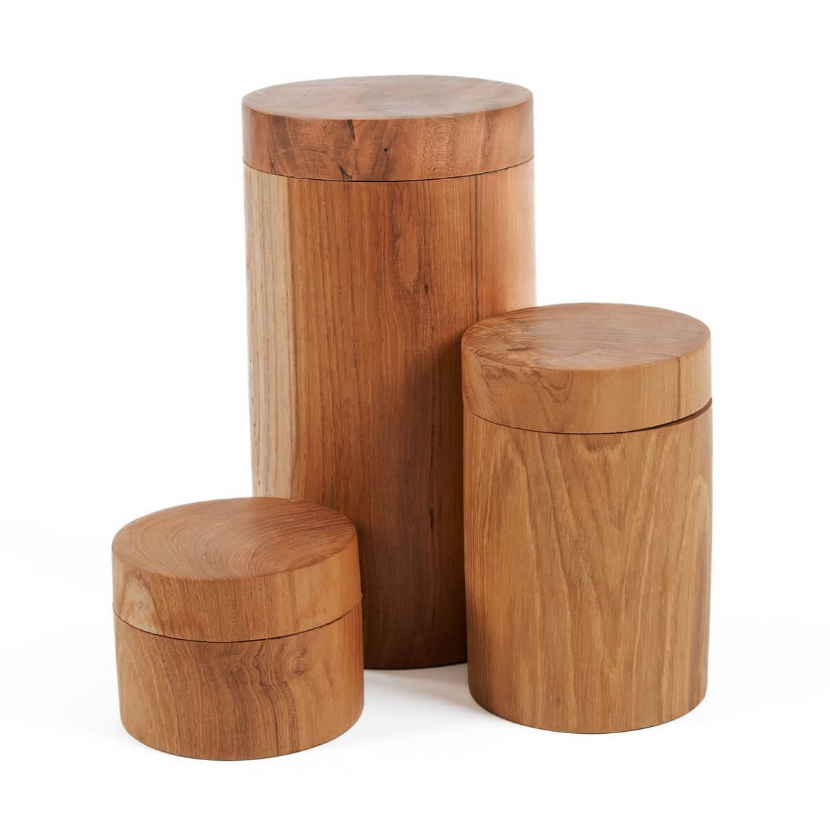 Bohemian-style teak root jars in three sizes, hand-carved with unique textures, perfect for stylish home decor and versatile storage.