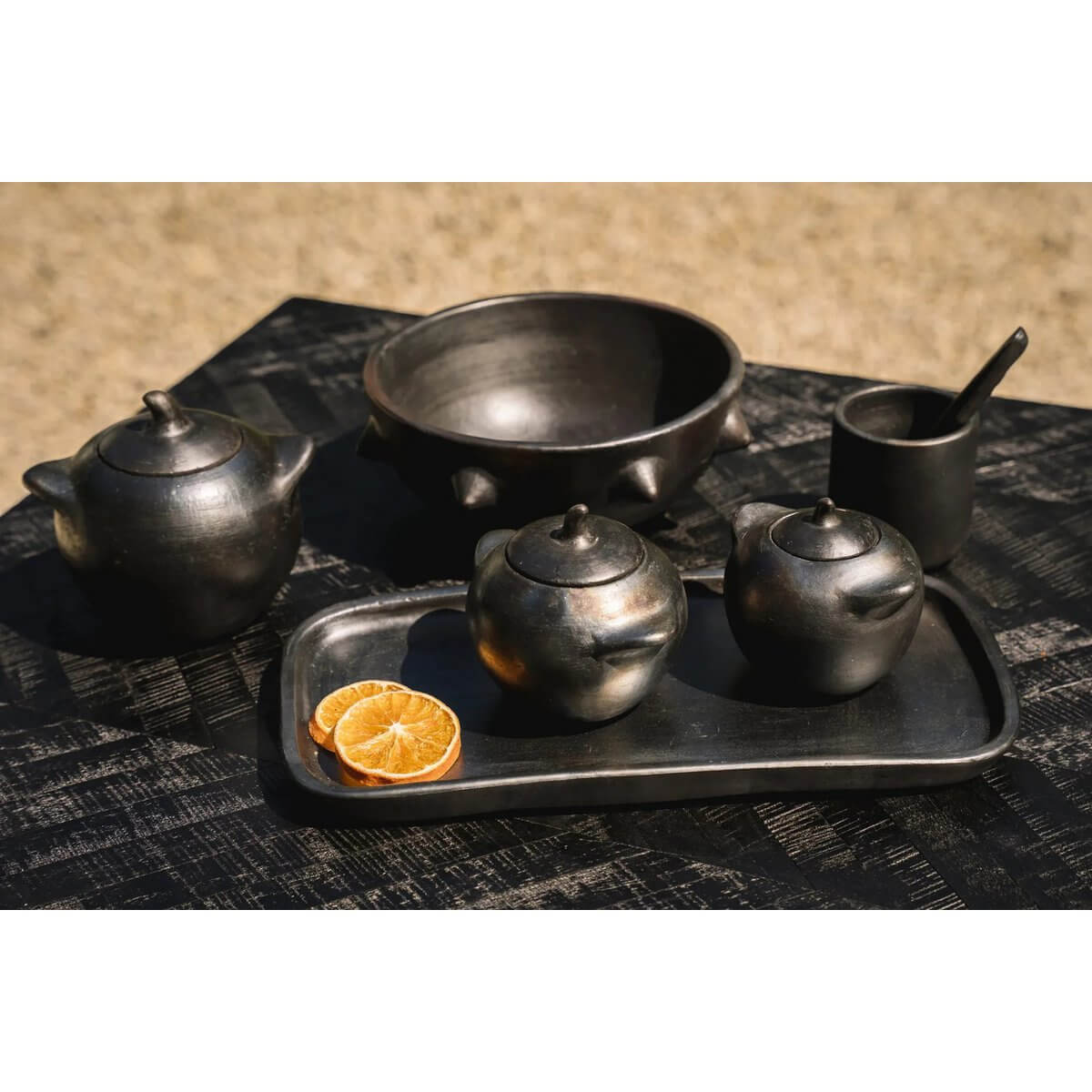 Bohemian-style black-burnt ceramic pots and tableware set, perfect for stylishly serving sugar, salt, or dry sauces with flair.