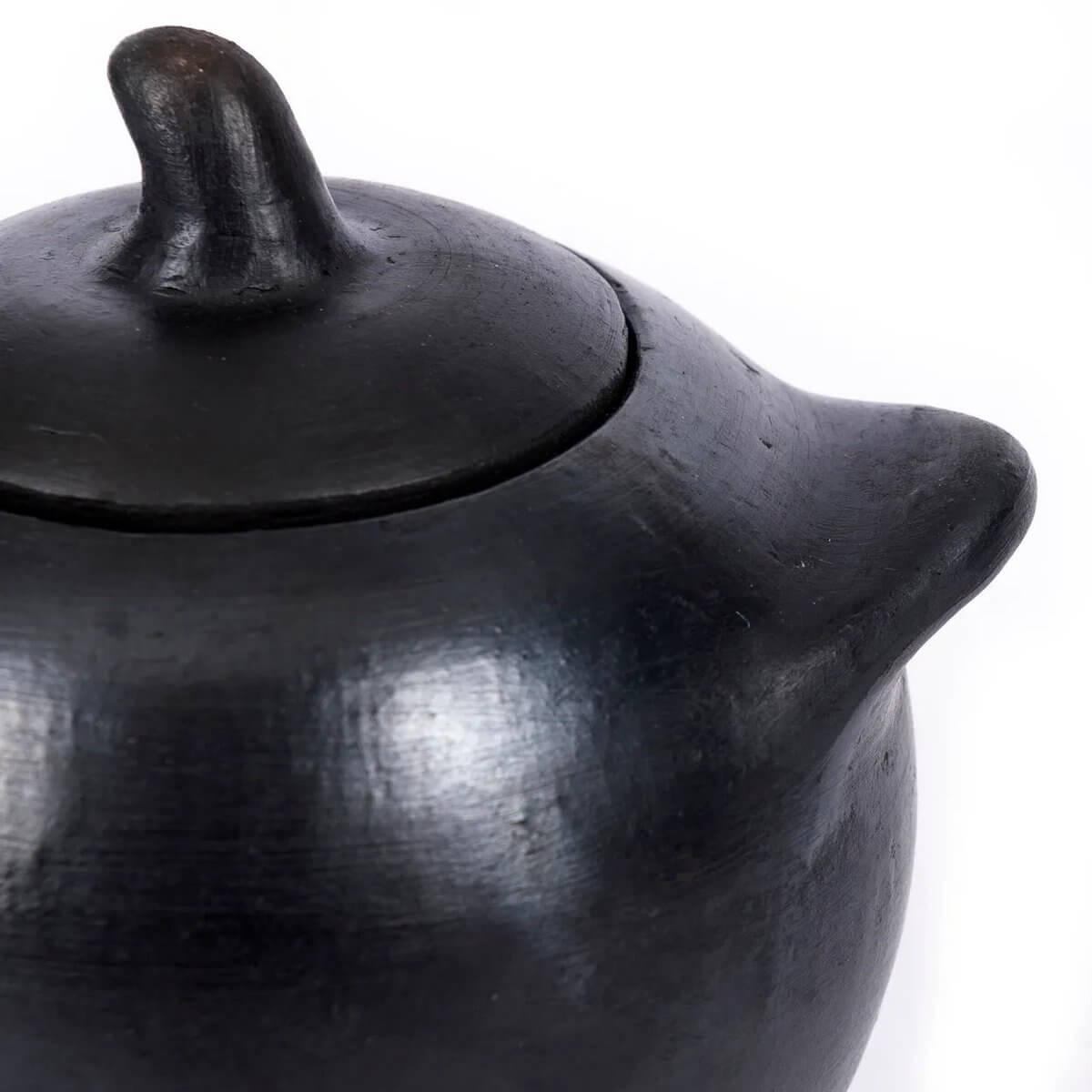 Bohemian black-burnt pot with lid, perfect for sugar or spices, adding unique charm to your table setting.