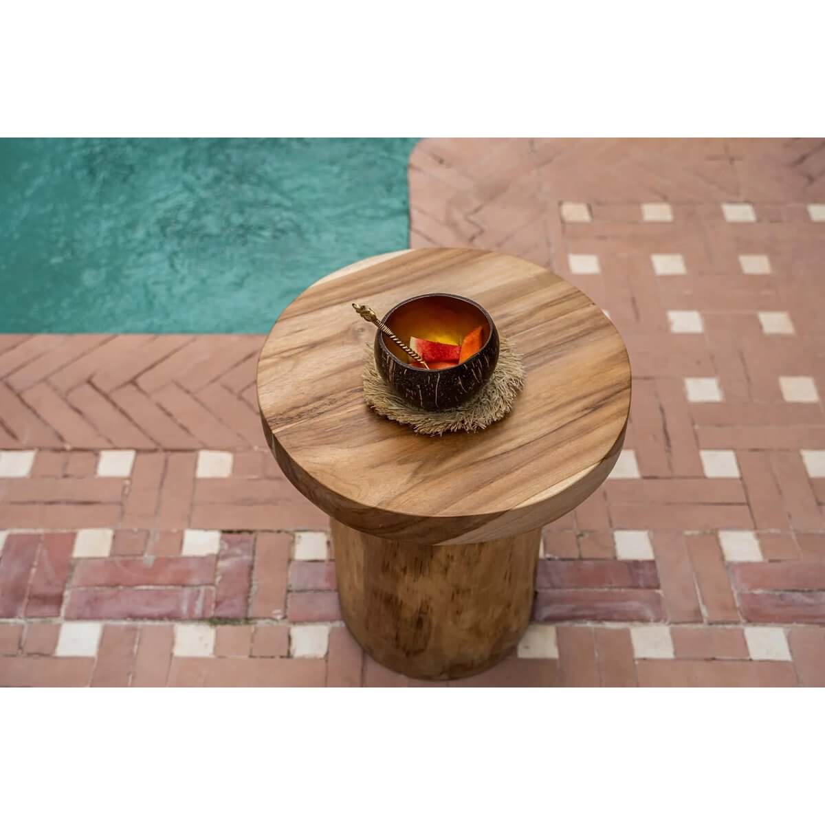 Bohemian style Coconut Food Bowl on a wooden table by a pool, perfect for breakfasts or smoothies, adding tropical vibes to your home.