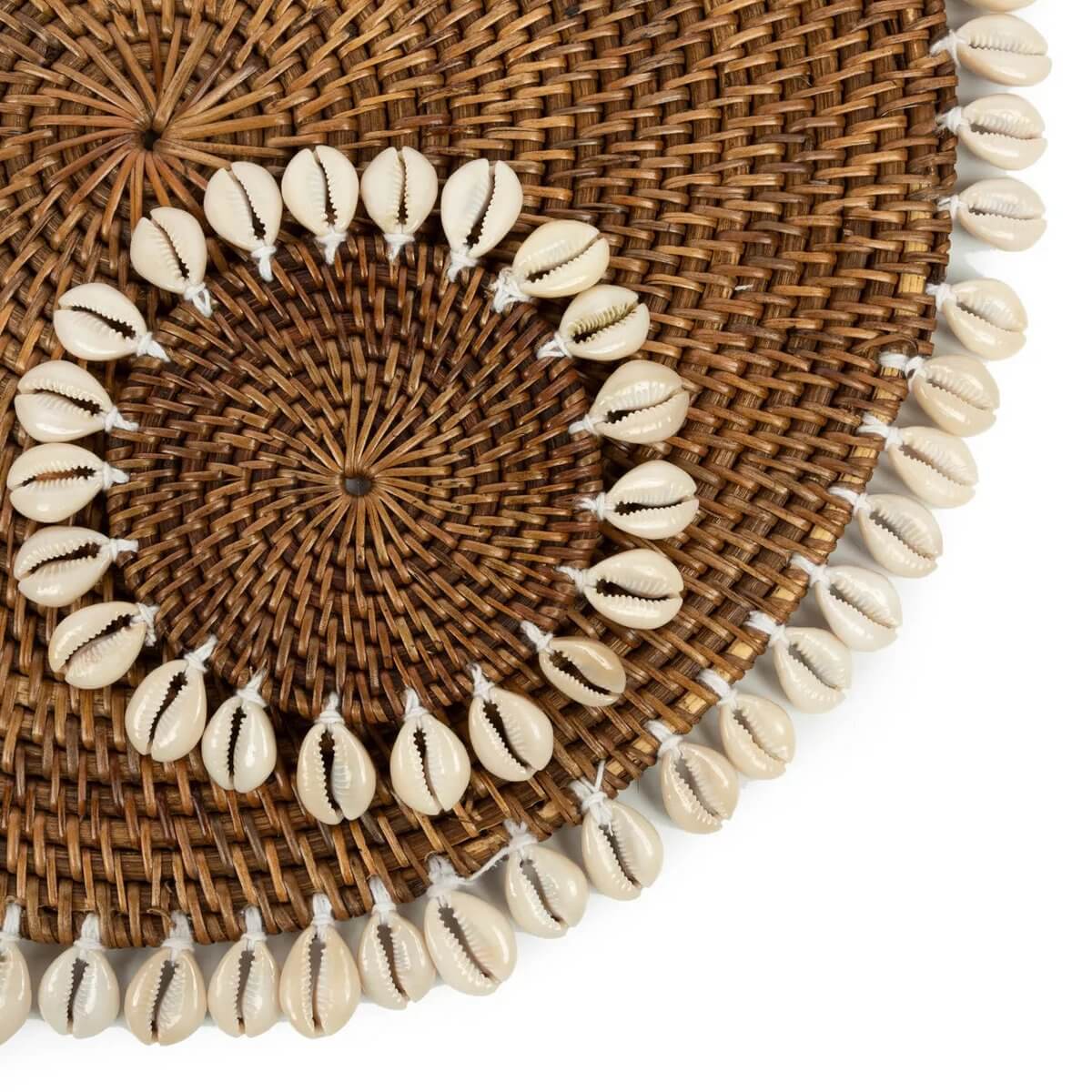 Bohemian Colonial Shell Coaster - woven rattan with cowrie shells, adds tropical elegance to any table. Natural brown tones.