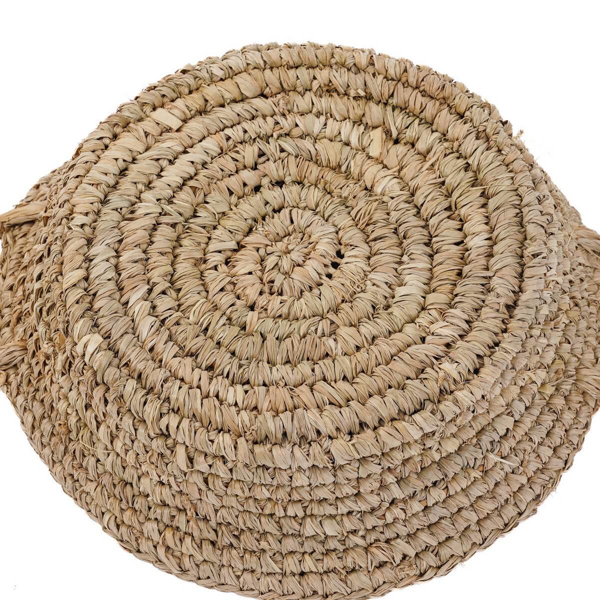 Bohemian style natural raffia basket tray, perfect for adding rustic elegance to shelves or countertops in smaller spaces.